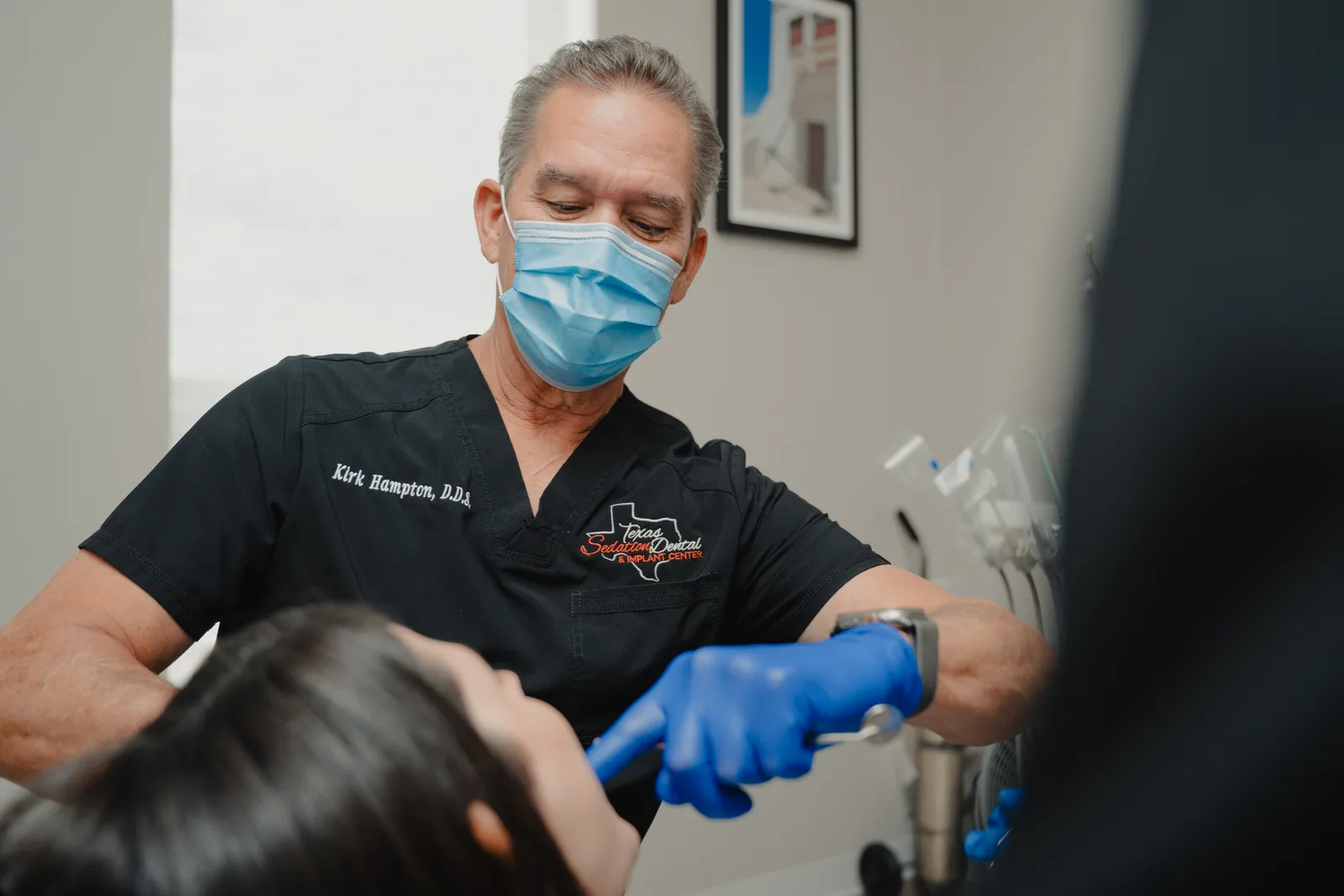 Dr. Hampton treating a patient in the dental chair